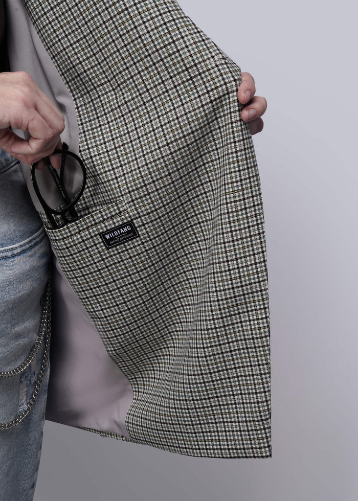 1X=Person holding a plaid blazer open with a visible brand label on a plain background