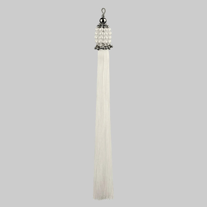 Beaded handcrafted polyester tassel by silver coated metal beads with systethic japanese pearl and white threads on grey background