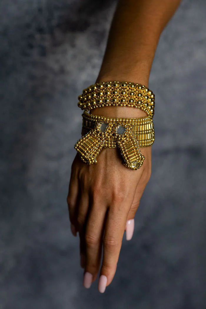 Object & Dawn ghost images of Amaya Bow band 22k gold wash front view front image