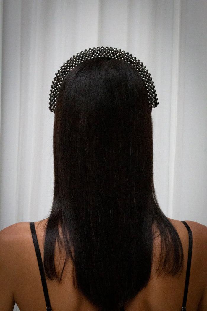 Object & Dawn Anais Headband jet black from back view worn by woman in neutral background