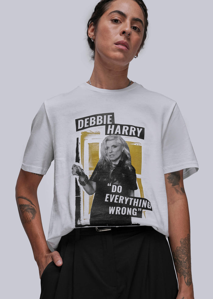 S=Person wearing a t-shirt with a graphic of Debbie Harry and text on a plain background