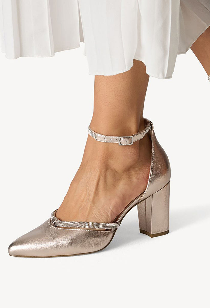 Metallic high-heeled shoe with a subtle pattern on a white background