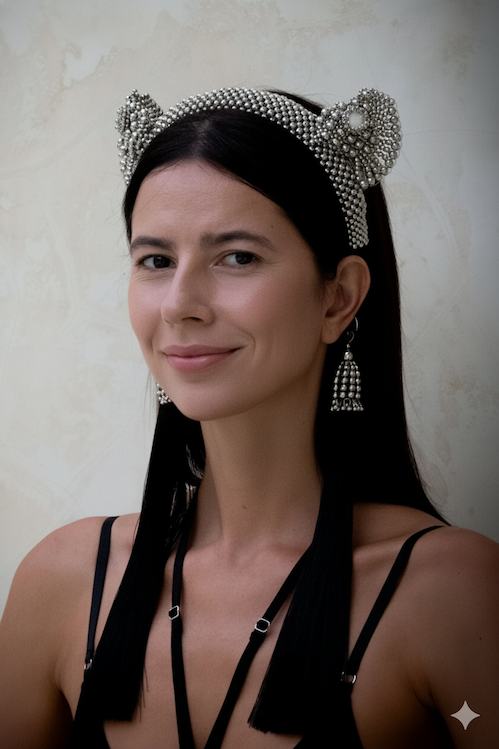 A woman with black long hair wearing Tamoe SIlk Harness Skirt and a jas headband in silver by Object&Dawn