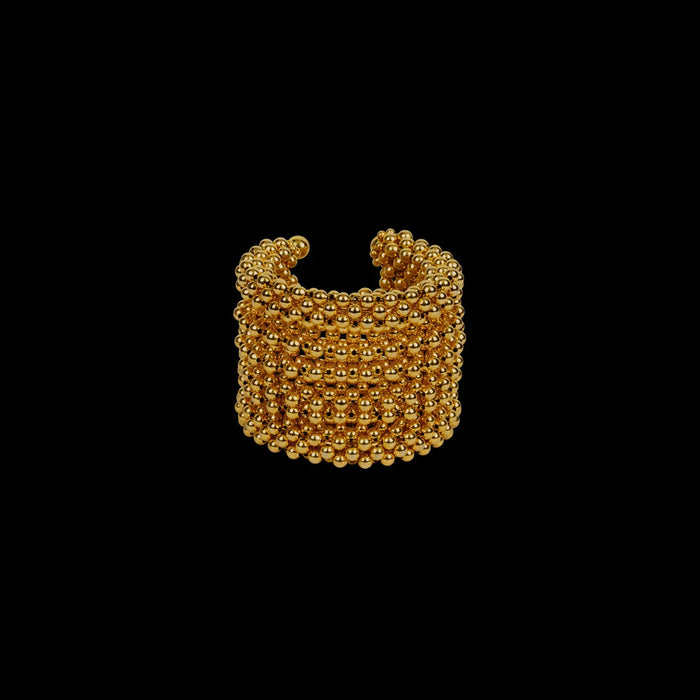 Khutulun beaded modular 22k gold wash on polymer siler metal beads ghost image front view on black background