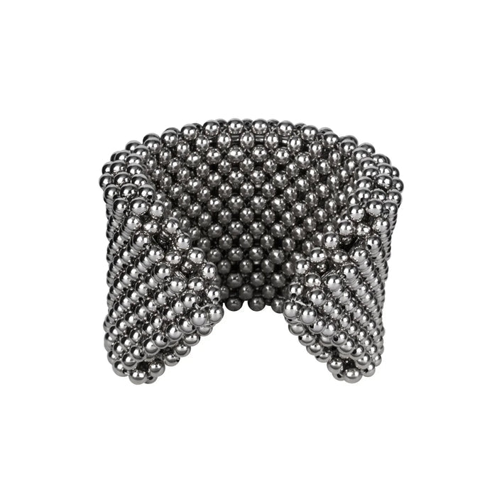 Object & Dawn handcrafted beaded wrist accessory in ivory, structured supple cuff with polymer metal beads, ghost image