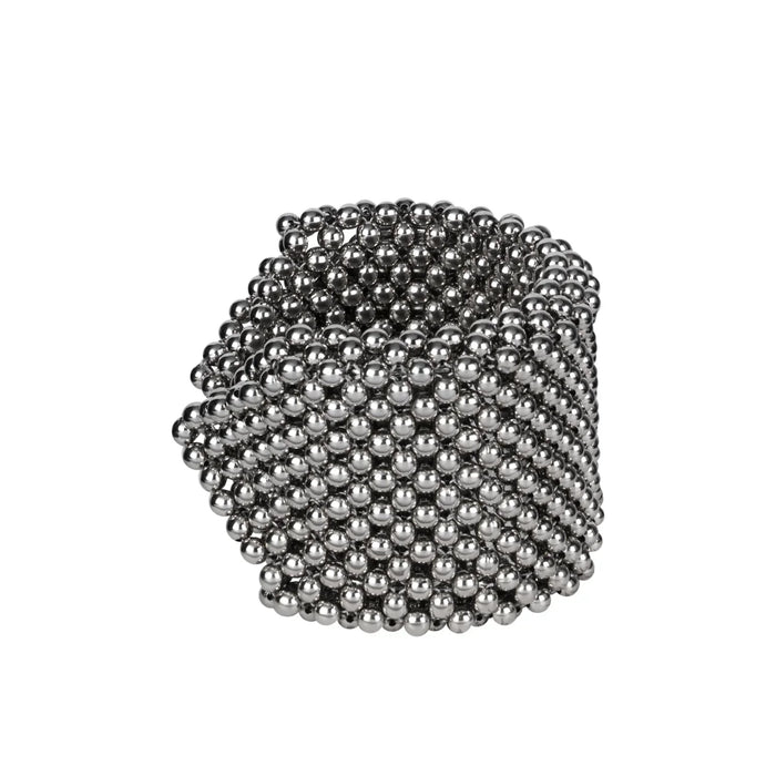 Object & Dawn beaded wrist accessory in ivory, structured supple cuff with polymer metal beads, ghost image side view