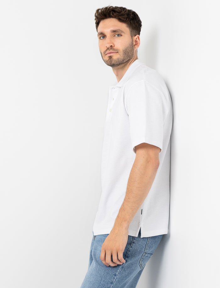 Polo en tricot texturé