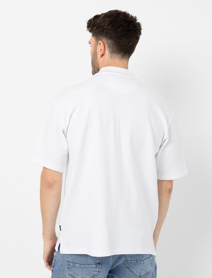 Polo en tricot texturé