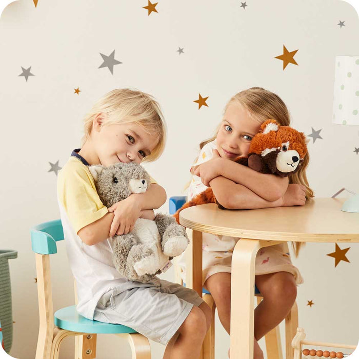 Little boy and girl sitting and hugging Cute Weighted Lavender Scented Squirrel Stuffed Animal Heating Pad Warmies
