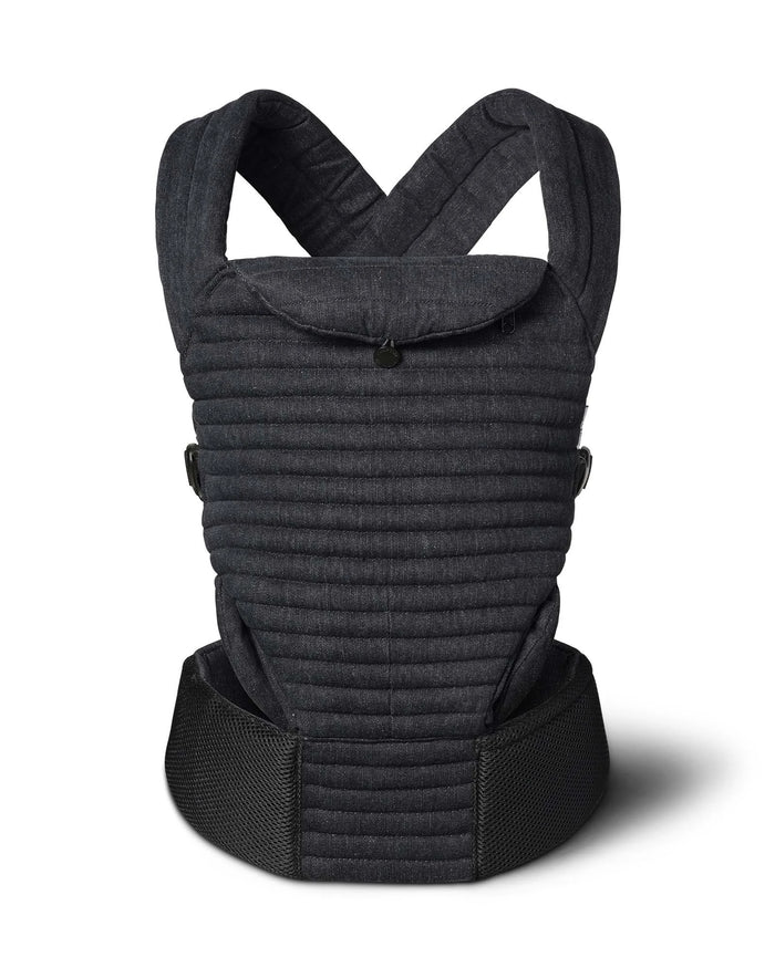 A Bumpsuit black denim quilted baby carrier with a padded front panel, adjustable shoulder straps, and a wide waist belt, shown on a white background with a soft shadow.