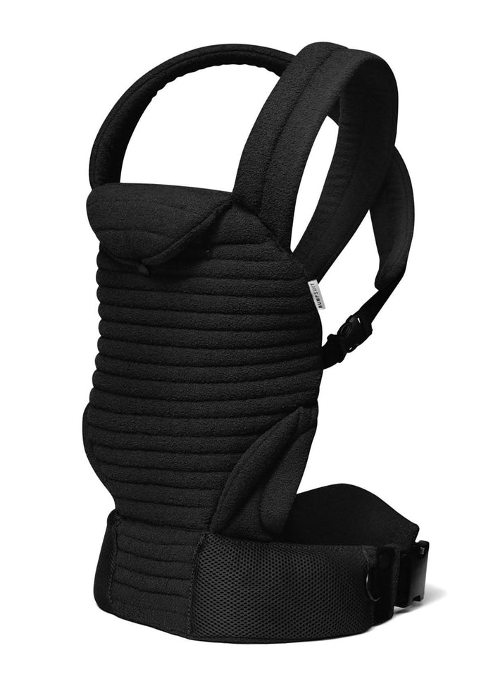 side view black armadillo baby carrier on white background
