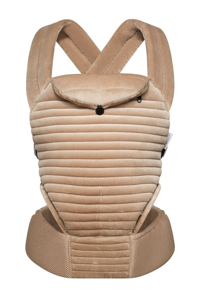 front view of the armadillo baby carrier in a sand color velvet