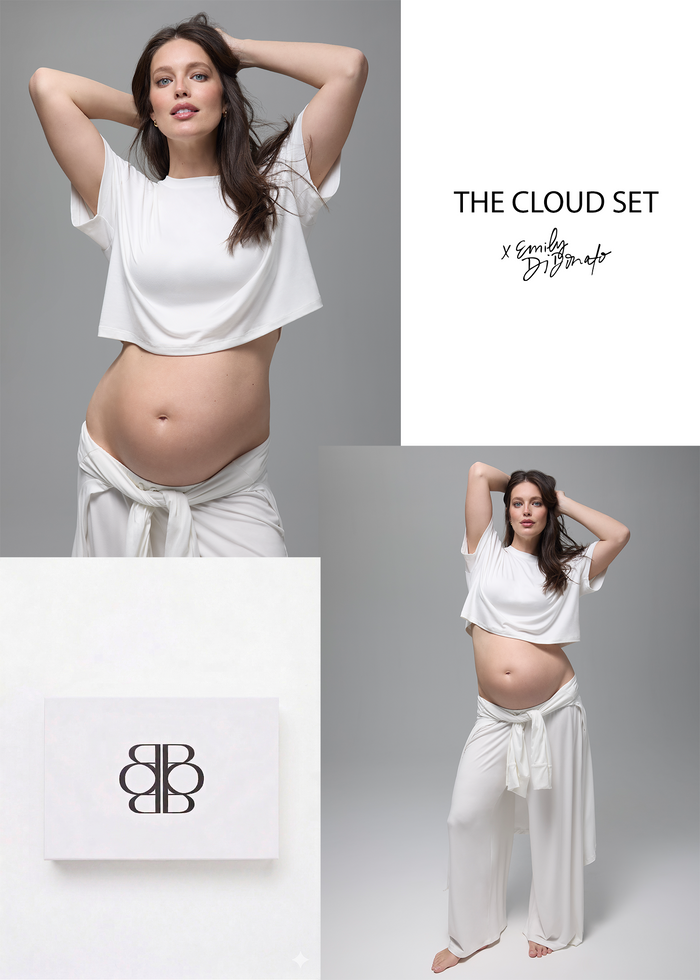Emily Didonato wearing a white bumpsuit cloud lounge outfit, featuring a box with a logo.