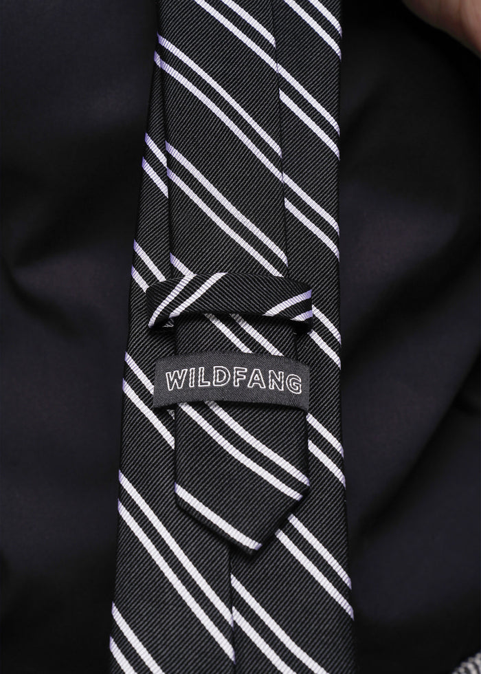 Black tie with white stripes and 'WILDFANG' label on a black background