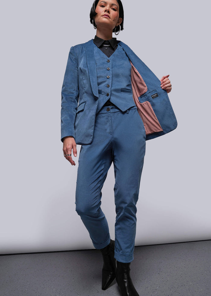 S=Person wearing a blue suit with a white background