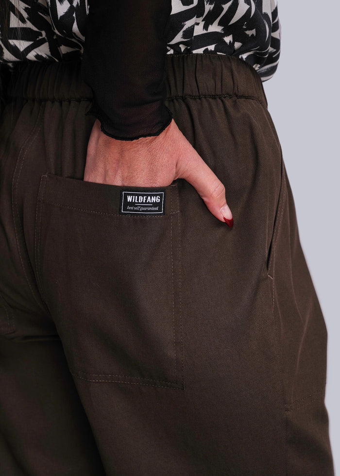 S=Brown pants with a visible brand label on a plain background