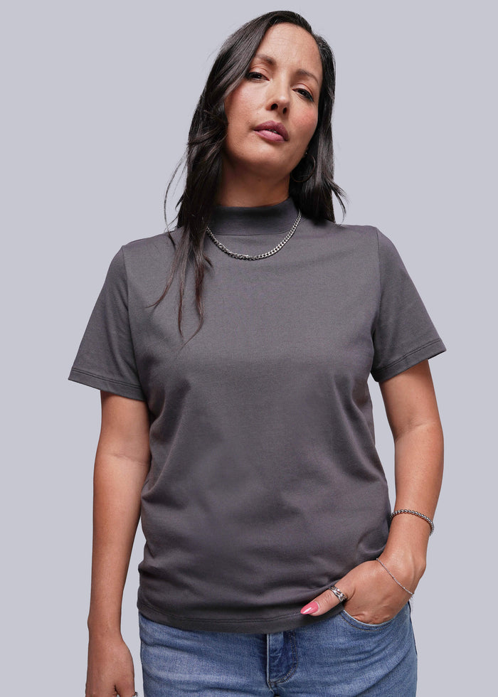 S=Woman wearing a gray t-shirt against a plain background