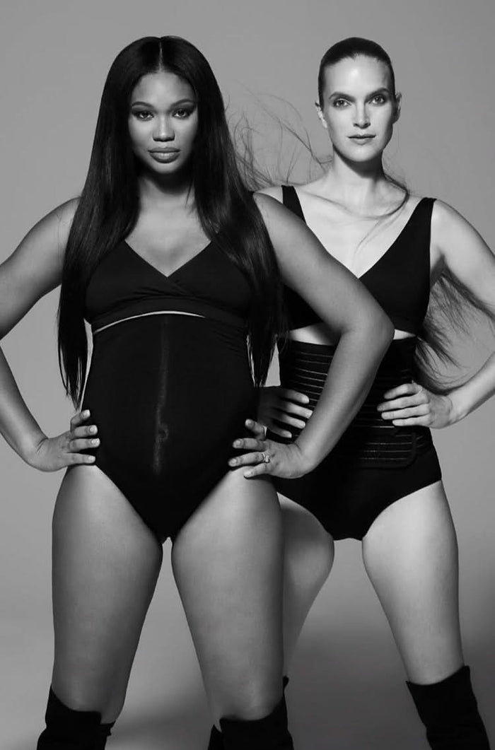 2 models wearing bumpsuit maternity wear in black