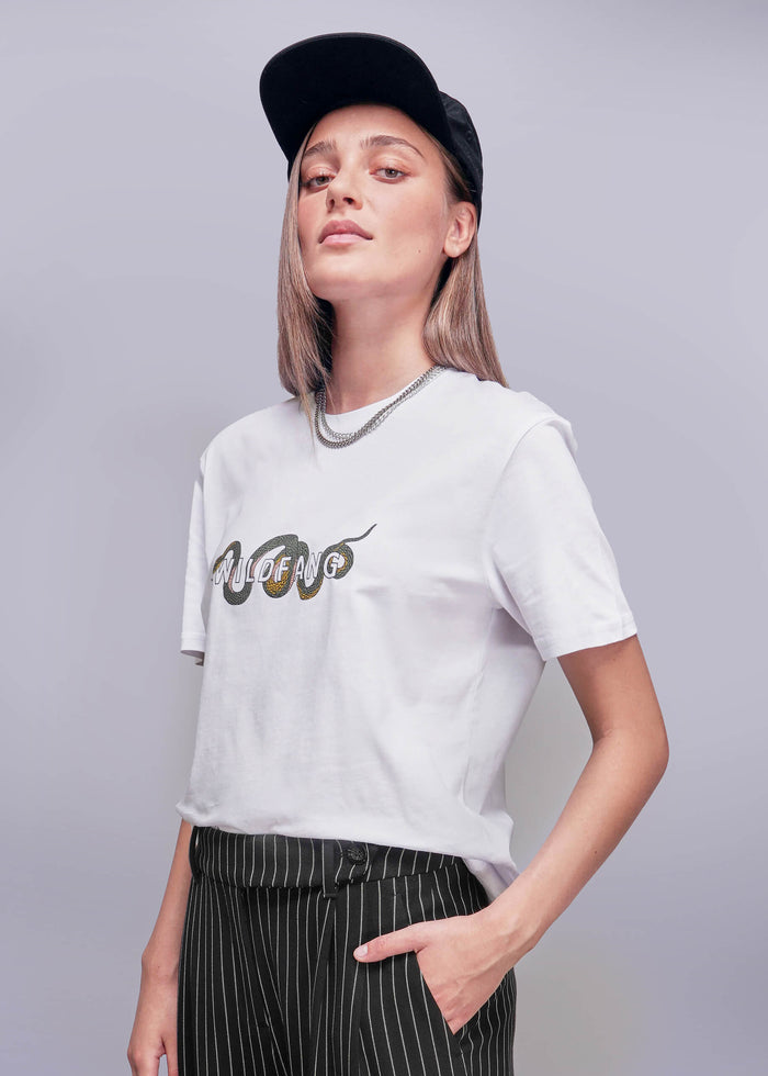 S=Person wearing a white t-shirt with a logo and a black cap on a gray background