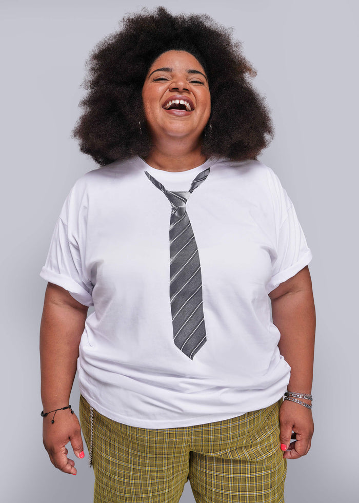 1X=Person wearing a white t-shirt with a tie design on a plain background