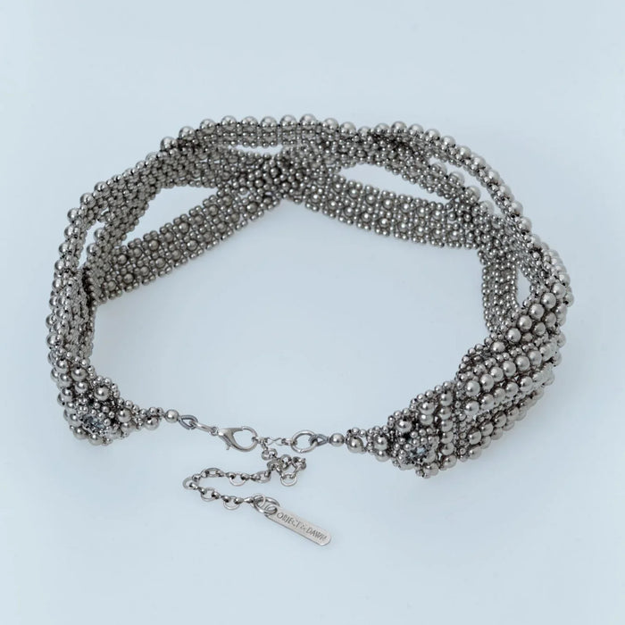 Beaded modular hat accessory from polymer metal beads by object and dawn on neutral background