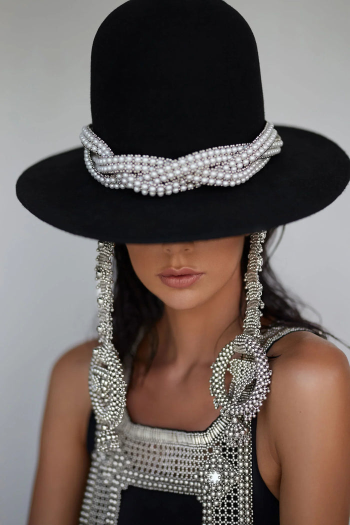 Beaded modular hat accessory from polymer metal beads and syntethis japananese pearl by object and dawn on neutral background